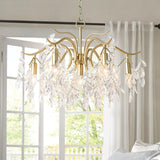Dorale Curated Solid Brass Chandelier warm illuminated room view