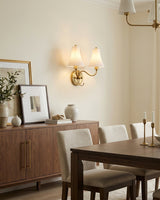 Dorienne Curated Solid Brass Wall Sconce warm illuminated room view