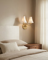 Dorienne Curated Solid Brass Wall Sconce installed in residential dining space