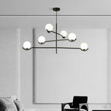 Doris Curated Mouth-Blown Frosted Glass Chandeli warm illuminated room view