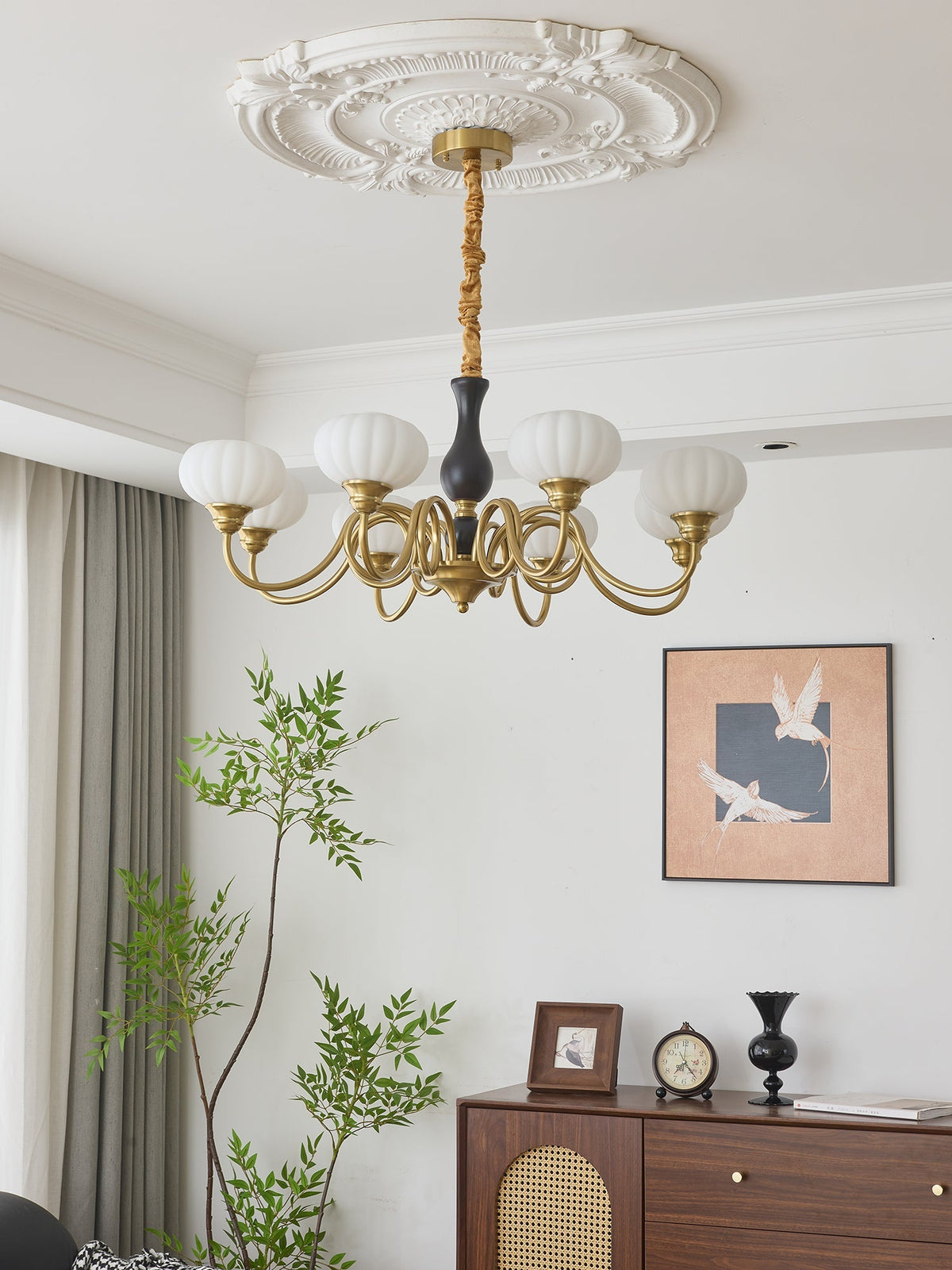 Elaris Curated Mouth-Blown Frosted Glass Chandel – illuminated warm ambiance setting