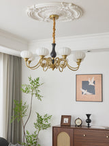 Elaris Curated Mouth-Blown Frosted Glass Chandel – illuminated warm ambiance setting