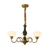 Elaris Curated Mouth-Blown Frosted Glass Chandel – illuminated warm ambiance setting #1