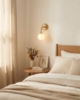 Elio Alabaster Curated Alabaster Wall Sconce warm illuminated room view