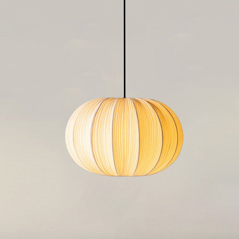 Elunor Curated Finished Iron Pendant Light – illuminated warm ambiance setting #1