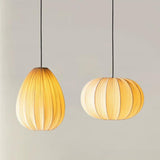 Elunor Curated Finished Iron Pendant Light installed in residential dining space