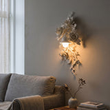 Elysia Bloom Curated Iron & Glass Wall Sconce installed in residential dining space