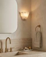 Fun Guy Alabaster Curated Alabaster Wall Sconce – illuminated warm ambiance setting