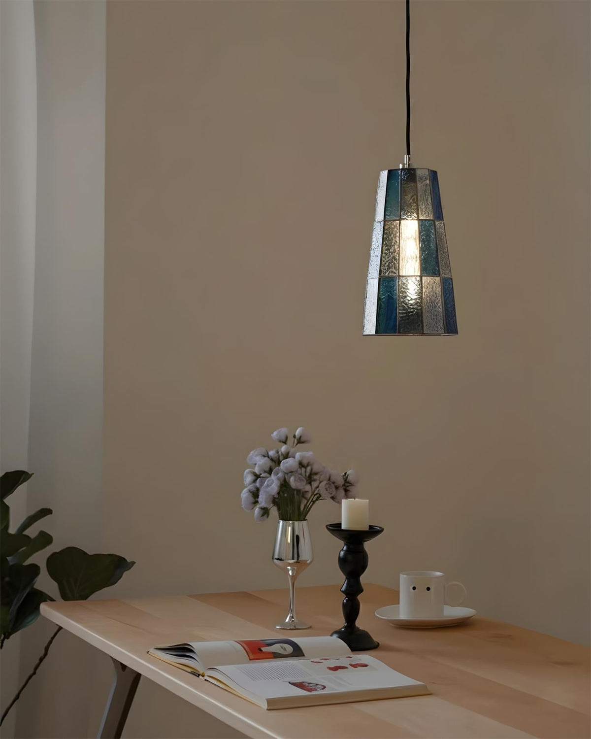 Fun Guy Curated Mouth-Blown Frosted Glass Pendan installed in residential dining space