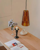 Fun Guy Curated Mouth-Blown Frosted Glass Pendan warm illuminated room view