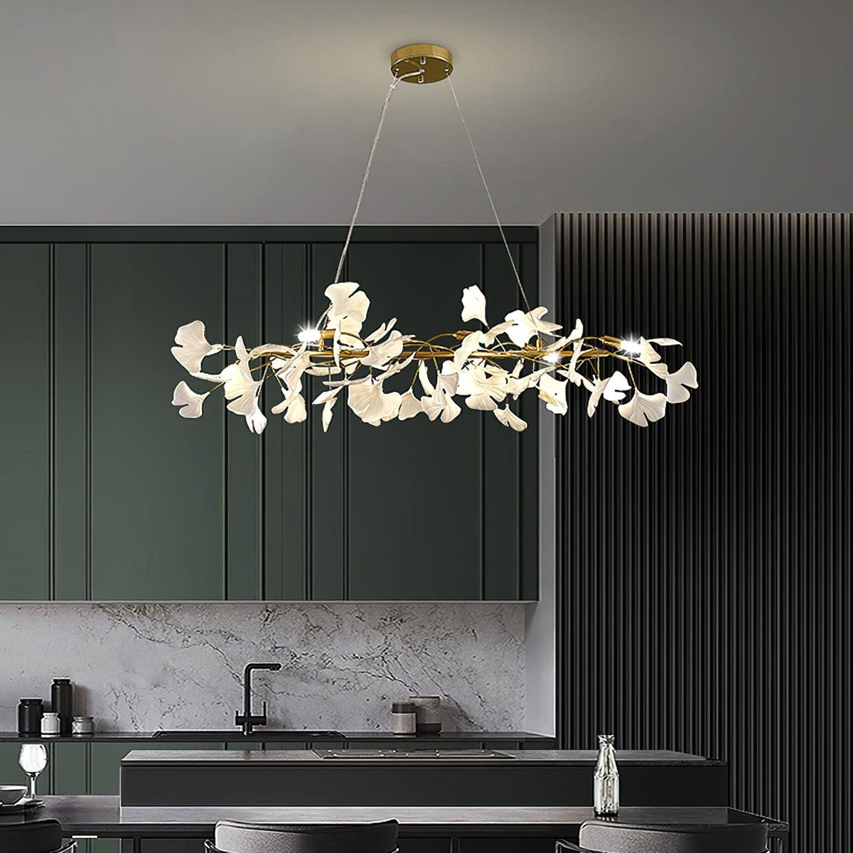 Gingko Branch Curated Solid Brass Chandelier warm illuminated room view