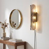 Glacium Plug-in Cast Glass Sconce installed in residential dining space