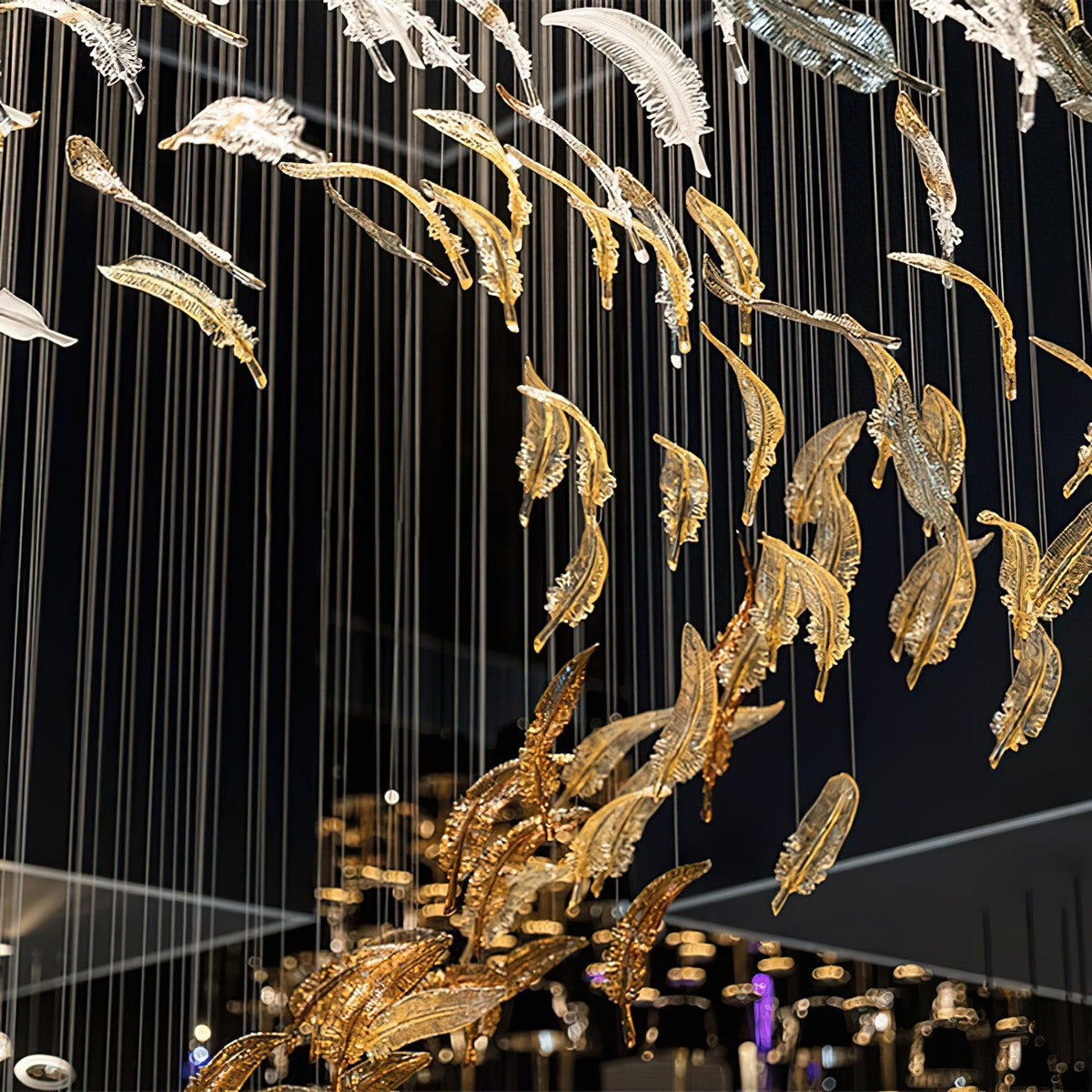 Pluma Sculptural Feather Chandelier – illuminated warm ambiance setting