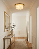Justice Alabaster Curated Alabaster Flush Mount – illuminated warm ambiance setting