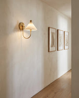 Kismet Alabaster Curated Alabaster Wall Sconce warm illuminated room view