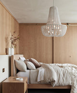Koralky Curated Iron & Glass Chandelier – spatial dining room perspective