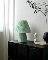 Green Stripe Mushroom Curated Iron & Glass Table installed in residential dining space