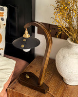 Lodora Curated Solid Brass Table Lamp warm illuminated room view