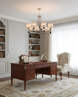 Loomcrest Curated Iron & Glass Chandelier warm illuminated room view