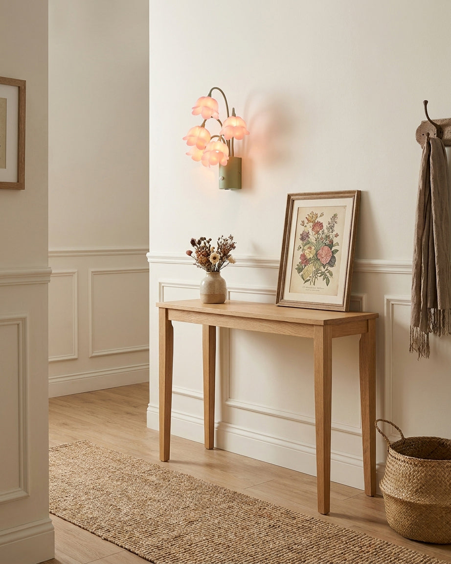 Lunelia Curated Iron & Glass Wall Sconce – illuminated warm ambiance setting