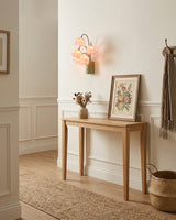 Lunelia Curated Iron & Glass Wall Sconce – illuminated warm ambiance setting