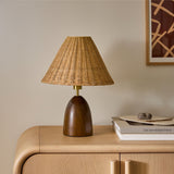 Lunora Curated Woven Rattan Table Lamp warm illuminated room view
