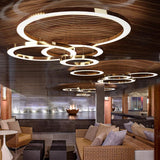 Ring LED Curated Optical Acrylic Chandelier installed in residential dining space