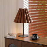 Marlow Pleat Curated Iron & Glass Table Lamp warm illuminated room view