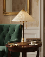 Merona Curated Woven Rattan Table Lamp warm illuminated room view