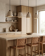 Mervane Curated Yellow Travertine Pendant Light installed in residential dining space