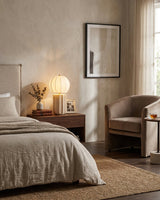 Mirelle Curated Yellow Travertine Table Lamp warm illuminated room view