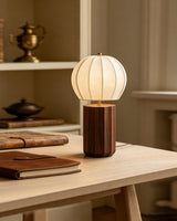 Mirelle Curated Yellow Travertine Table Lamp installed in residential dining space