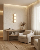 Neptune Alabaster Curated Alabaster Wall Sconce installed in residential dining space