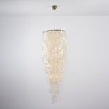 Nerida Shell Curated Iron & Glass Chandelier – illuminated warm ambiance setting #1
