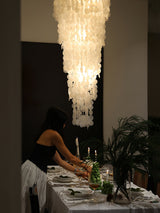 Nerida Shell Curated Iron & Glass Chandelier – illuminated warm ambiance setting