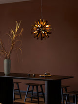 Nova Burst Curated Iron & Glass Chandelier – illuminated warm ambiance setting