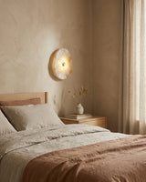 Onyvelle Alabaster Curated Alabaster Wall Sconce warm illuminated room view