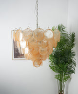 Orange Glass Disc Chandelier – Ambient Illumination in Luxury Interior Setting View 5