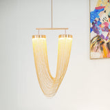 Otero Curated Iron & Glass Chandelier installed in residential dining space