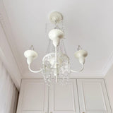 Pavia Curated Mouth-Blown Frosted Glass Chandeli – spatial dining room perspective