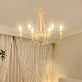 Pavia Curated Mouth-Blown Frosted Glass Chandeli warm illuminated room view