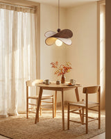 Petavin Curated Solid Brass Pendant Light warm illuminated room view
