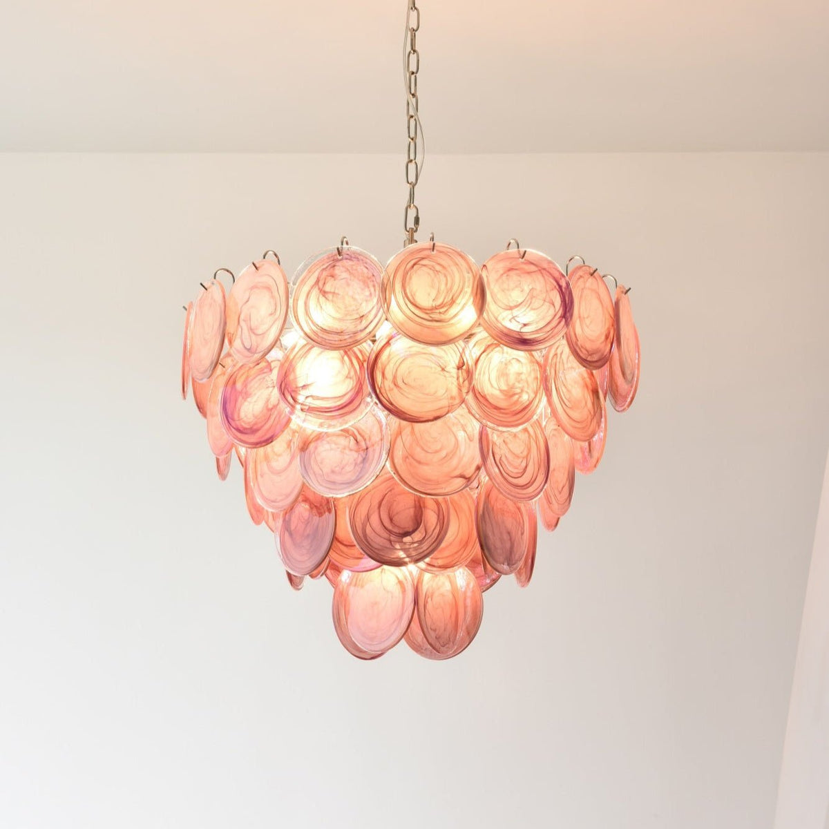 Pink Glass Disc Curated Mouth-Blown Frosted Glas warm illuminated room view
