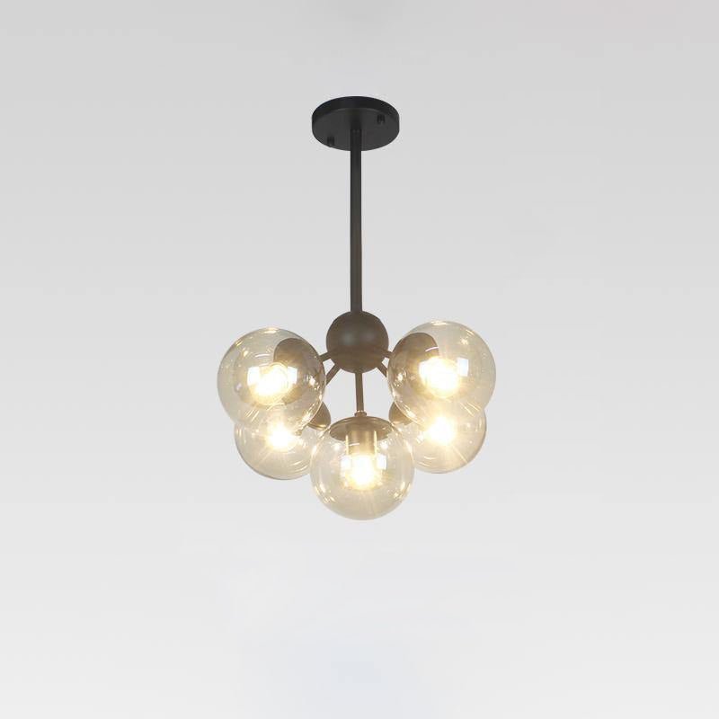 Vertex Curated Amber Art Glass Chandelier – illuminated warm ambiance setting #1