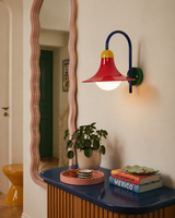 Primora Curated Iron & Glass Wall Sconce warm illuminated room view
