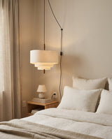 Raphia Curated Iron & Glass Pendant Light warm illuminated room view