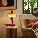 Ravelin Curated Mouth-Blown Frosted Glass Table – illuminated warm ambiance setting