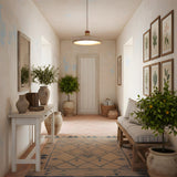 Riven Curated Yellow Travertine Pendant Light installed in residential dining space
