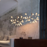Rose Gold Firefly LED Curated Iron & Glass Chand installed in residential dining space