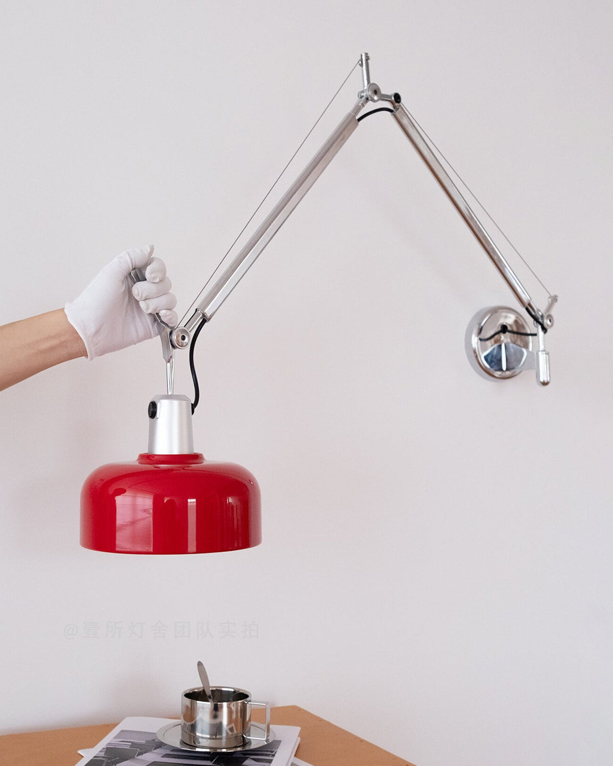 Rosso Swing Arm Curated Iron & Glass Wall Sconce – spatial dining room perspective